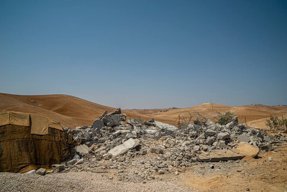 Masafer Yatta is a desert region of the southern West Bank that is home to 1,144 Palestinians living across 12 villages. Their lives changed drastically in the 1980s when the land on which their homes are built was declared to be a ‘closed military zone’ by the Israeli authorities. On 4 May 2022, the Israeli Supreme Court declared that there were no ‘legal barriers’ to the evictions. As a result of the decision, 211 Palestinian households (1144 people) are at immediate risk of forced evictions, arbitrary displacement, and forcible transfer. The decision of the Israeli Supreme Court in May 2022 has resulted in a sharp uptick in hostile measures applied by the Israeli authorities in Masafer Yatta to put extraordinary pressure on residents of Masafer Yatta to leave their homes. Such measures include the demolition of homes and schools, issuance of eviction notices and an increase in checkpoints, confiscation of residents’ vehicles, military training, night-time home incursions, enforced curfews, and other movement restrictions, making people’s lives unbearable. Médecins Sans Frontières/Doctors without Borders (MSF) is providing medical health services via mobile clinics to the residents of Masafer Yatta since 2021, and mental health care in the Hebron Governorate since 1996. MSF’s witnessed first-hand the impact of the increasingly coercive and oppressive environment on the physical and mental health of the people in Masafer Yatta.